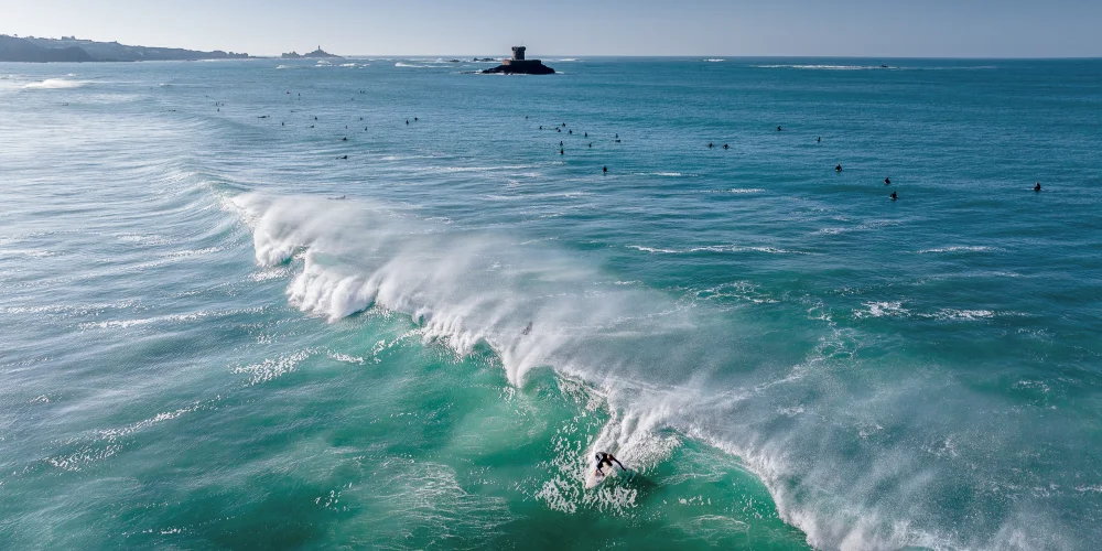 A surfer riding a wave